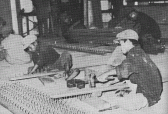 Making threshing machines in an Army workshop west of Phnom Penh