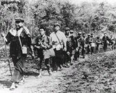 Pol Pot in 1980 leading his cadres on a Long March