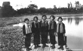 Muslim Khmer Rouge Cadres posing in front of a Mosque